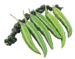 Green pepper chili and a black bell pepper