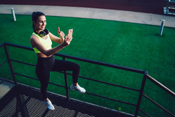 Female runner taking selfie on smartphone