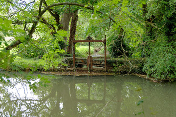 River Windrush in Cotswold town of Burford - England