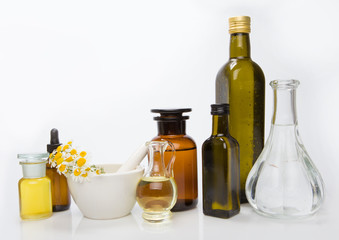 Set bottles of essential oil, white background. Healthy cosmetics concept.