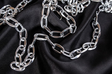 luxury black wavy silk texture with frame of chain background