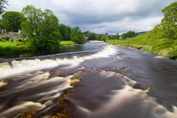 Water flowing down a weir and over rocks at Linton Falls