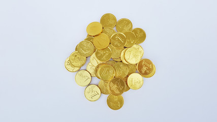 A pile of gold coins isolated on white