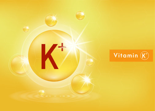 Vitamin K+ shining pill capsule icon . Vitamin with Chemical formula. Shining golden substance drop. Beauty treatment nutrition skin care design. Vector EPS 10