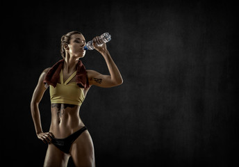 young fitness woman with bottle water