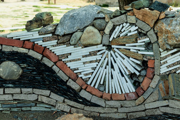 The composition is made of a variety of multicolored decorative stones.