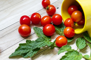 cherry tomatoes on wooden table background