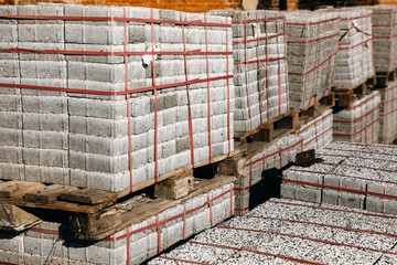 Warehouse with concrete blocks for sidewalk construction .
