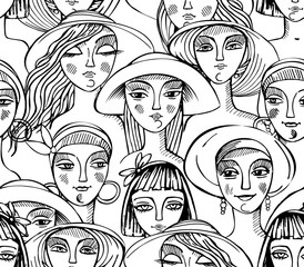 Black and white drawing of female faces. Doll heads in trendy hats. Seamless vector pattern in fashion style.