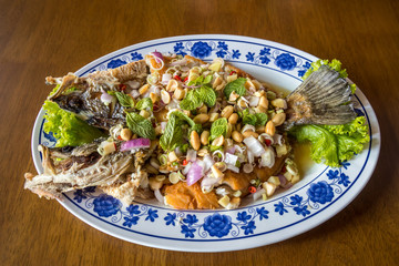 Thai food fried fish with spicy sauce isolated in white background.Thai Food : Ingredients of Fish...