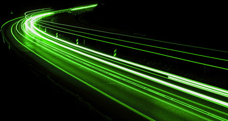 abstract green car lights at night
