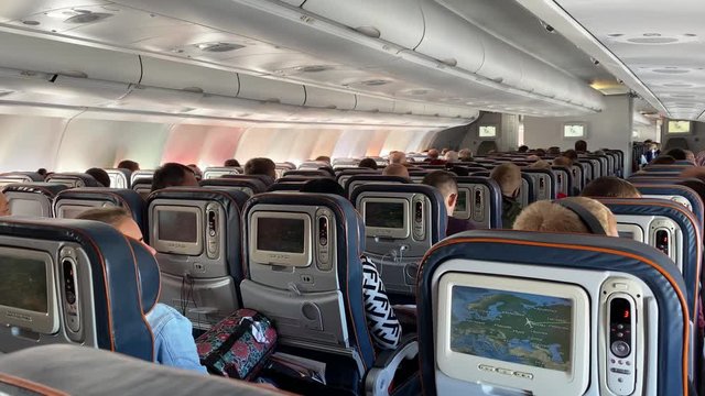 On board an Airbus A330, in flight, three rows of seats