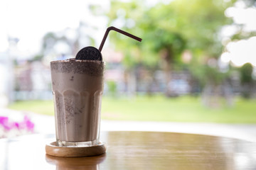 A glass of Smoothies chocolate on table. A glass of Smoothies Cocoa cool drink served on table....