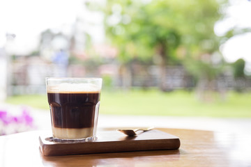Coffee with condensed milk. Coffee with condensed milk in a transparent glass.Vietnamese coffee with condensed milk in glass cups. Traditional method of making of vietnamese coffee
