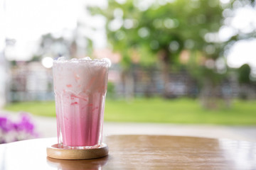 Beverage of Juice for Summer put on the table. Pink strawberry milkshake. Strawberry smoothie or milkshake for healthy dessert. Pink milk in glass. 