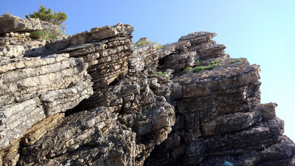 Fototapeta na wymiar Layered cliffs on the adriatic coast (Montenegro, Budva)