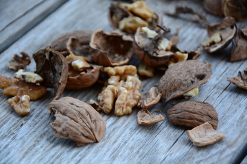 Fototapeta na wymiar walnuts on wooden background
