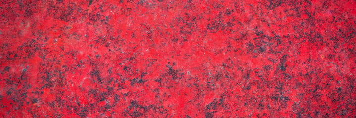 red grunge painted metal texture of a junk car body, panoramic web banner