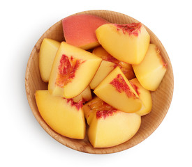 ripe peach in wooden bowl isolated on white background with clipping path. Top view. Flat lay pattern