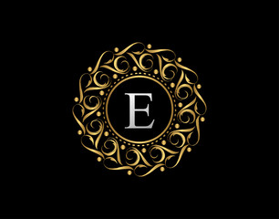 Gold Calligraphic Badge with Letter E Design. Ornamental luxury golden logo design vector illustration.