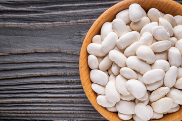 Fresh organic natural beans on wooden rustic background