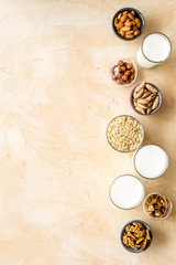 Fototapeta na wymiar Glasses of non-dairy vegan milk - lactose free nuts and grain drink. Top view
