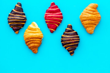 Croissants pattern - set of snacks on blue background