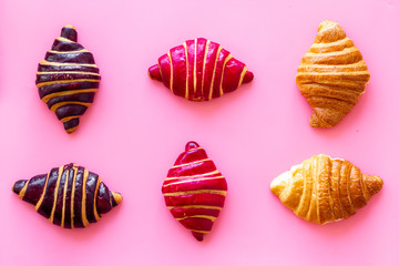 Croissants pattern - set of snacks on pink background