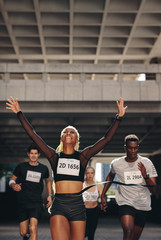 Winning athlete crosses the finish line