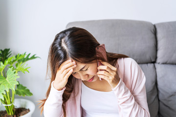 Young depressed and stressed woman crying and having serious conversation at home, Negative emotion...