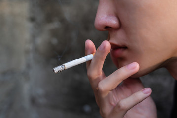 Stop smoking and Quit smoking cigarettes concept. Handsome man holding  cigarette in hands. Quit...