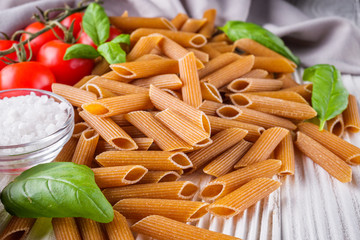concept of traditional italian pasta with tomatoes and basil