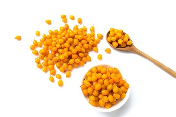 Set of fresh sea buckthorn on a white background. Sea buckthorn in a wooden spoon. View from above.