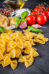 concept of traditional italian pasta with tomatoes and basil