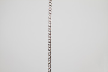 pocket silver chain vertically   on white background 