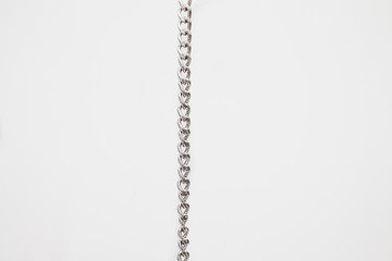 pocket silver chain vertically   on white background 