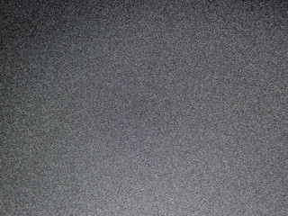 Dark grey textured grainy background