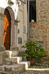 A narrow street among the old houses of Lenola, a medieval village in the Lazio region.