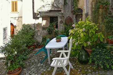 A narrow street among the old houses of Lenola, a medieval village in the Lazio region.