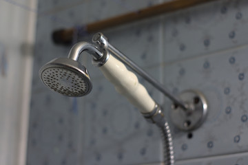 Obraz premium old shower head on a wall mount