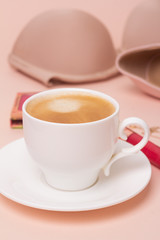 a cup of black coffee on the background of female accessories close-up.