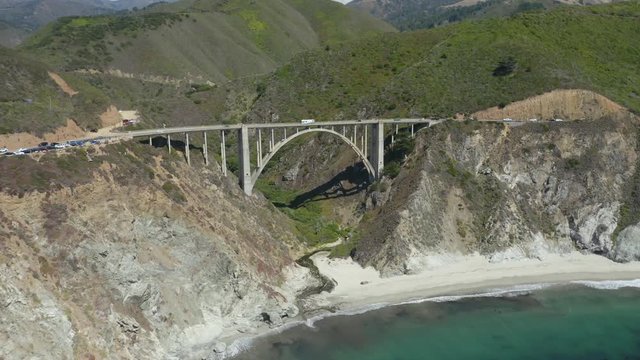 Drone Flies Above Iconic Bixby Creek Bridge in Big Sur, California on Highway 1 - Summer Day