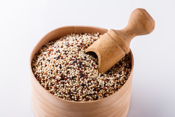 mix of quinoa grains on white acrylic background