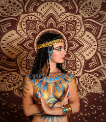 Fototapeta na wymiar Nefertiti, Queen of Egypt. Stylized fashion. A woman in historical clothing style. Egyptian Priestess 