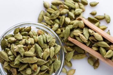 fragrant green cardamom on a white acrylic background