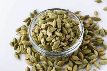 fragrant green cardamom on a white acrylic background