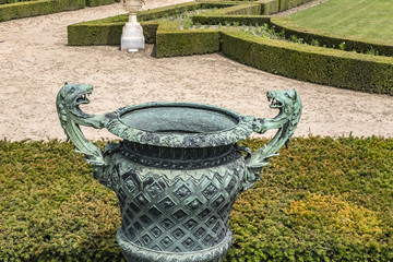 Beautiful Antique Bronze Vases in Gardens of Versailles palace. Royal Versailles palace and...