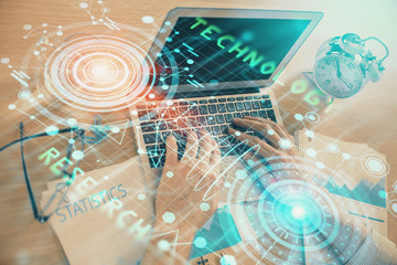 Businessman with computer background with technology theme hologram. Concept of big data. Double exposure.