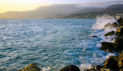 Stormy sea at sunrise in Hersonissos on Crete island in Greece
