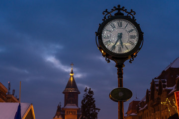 Fototapeta na wymiar The town clock of Timisoara. Night scene. Rainy day.